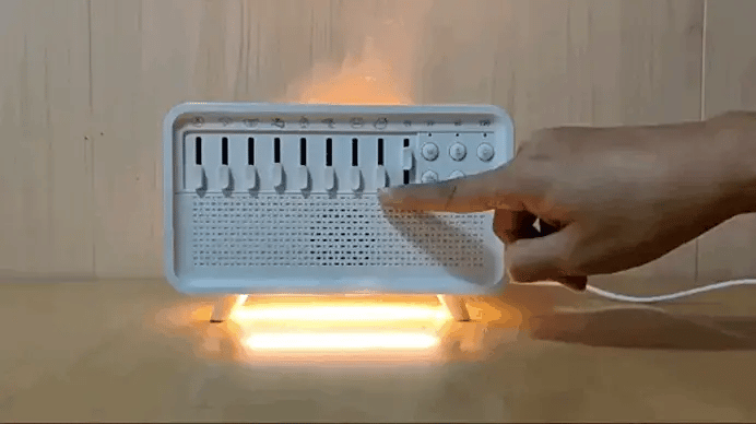 4 in 1 White Noise Humidifier on wooden table emitting soft mist and warm light for relaxation and sleep