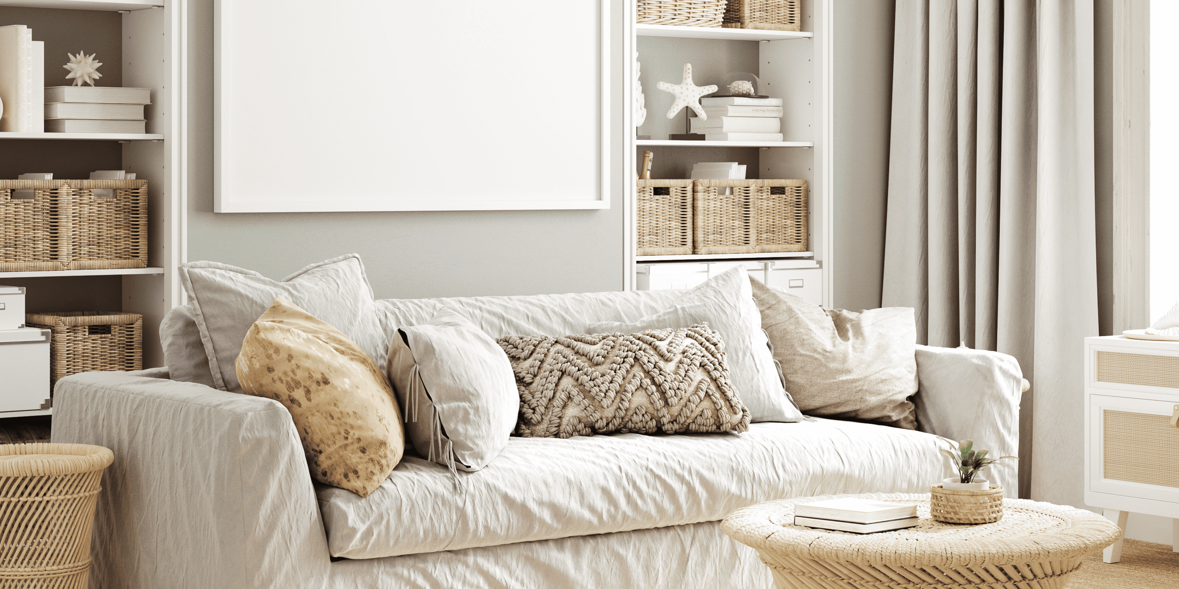 Living room with a beige sofa, decorative pillows, and a coffee table.