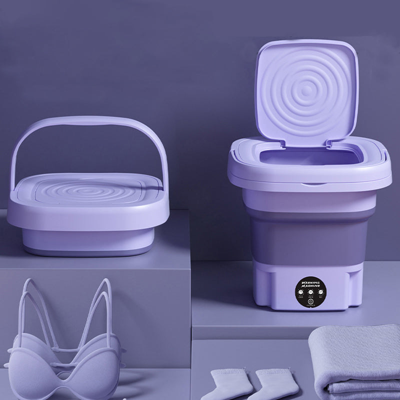 Collapsible purple washing machine with accessories on a matching purple background